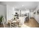 Well-lit eat-in kitchen featuring white cabinetry and granite countertops and stainless appliances at 315 Pine Crest View Dr, Summerville, SC 29486