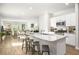 Open-concept kitchen with a granite island, stainless steel appliances, and bar stool seating at 315 Pine Crest View Dr, Summerville, SC 29486