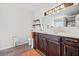 Bathroom boasting a vessel sink, granite countertops, dark wood cabinetry, and modern lighting fixtures at 315 Sabal Palmetto Ct, Moncks Corner, SC 29461
