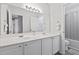 Bathroom featuring double sinks, a large mirror, and modern lighting at 315 Sabal Palmetto Ct, Moncks Corner, SC 29461