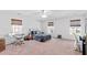 Well-lit bedroom with a ceiling fan, musical instruments, and ample space for activities at 315 Sabal Palmetto Ct, Moncks Corner, SC 29461
