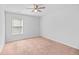 Bedroom with ceiling fan, window, plush carpet, and ample natural light at 315 Sabal Palmetto Ct, Moncks Corner, SC 29461