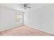 Neutral bedroom with a ceiling fan, window, and plush carpet at 315 Sabal Palmetto Ct, Moncks Corner, SC 29461