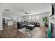 Spacious living room with hardwood floors, fireplace, ceiling fan, and plenty of seating at 315 Sabal Palmetto Ct, Moncks Corner, SC 29461