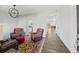 Bright living room featuring hardwood floors, modern lighting, and comfortable leather seating at 315 Sabal Palmetto Ct, Moncks Corner, SC 29461
