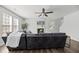 Bright living room with a fireplace, ceiling fan and comfortable seating at 315 Sabal Palmetto Ct, Moncks Corner, SC 29461