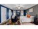 Spacious main bedroom featuring a tray ceiling, ceiling fan, and decorative blue accent wall at 315 Sabal Palmetto Ct, Moncks Corner, SC 29461