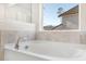 A close up of a soaking tub under a window that offers natural light at 330 Pine Crest View Dr, Summerville, SC 29486