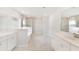 A bright bathroom offers double sinks, and a tiled walk-in shower at 330 Pine Crest View Dr, Summerville, SC 29486