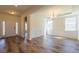 Spacious dining room with elegant chandelier, classic trim work, and ample natural light from large windows at 330 Pine Crest View Dr, Summerville, SC 29486