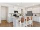 Bright, modern kitchen with white cabinets, stainless steel appliances and a spacious island with seating at 330 Pine Crest View Dr, Summerville, SC 29486