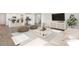 Open-concept living room with a kitchen view, modern furnishings, neutral tones, and hardwood floors at 330 Pine Crest View Dr, Summerville, SC 29486