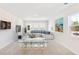 Bright living room with a comfortable sofa, a wine bar table, a dart board, and a large window at 330 Pine Crest View Dr, Summerville, SC 29486