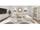 Cozy living room with a waterfront view, large sectional sofa, stylish decor, and an abundance of natural light at 330 Pine Crest View Dr, Summerville, SC 29486