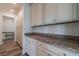 Well-organized pantry with granite countertops, ample cabinet space, and convenient access to the kitchen area at 330 Pine Crest View Dr, Summerville, SC 29486