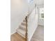 Bright staircase featuring carpeted stairs, white railings, and wood accents, providing an inviting transition between floors at 330 Pine Crest View Dr, Summerville, SC 29486