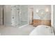 Bathroom with a large glass shower, double sink vanity, and a soaking tub at 3897 Summerton St, Mount Pleasant, SC 29466