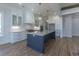 Well-lit kitchen with white cabinets, granite countertops, and a large island with seating at 3897 Summerton St, Mount Pleasant, SC 29466