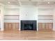 Living room showcasing a fireplace with built-in shelving and cabinets, offering ample storage at 3897 Summerton St, Mount Pleasant, SC 29466