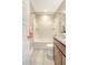 Bathroom with shower-tub combo, gray tile, and granite countertop at 3941 Four Poles Park Dr, North Charleston, SC 29405