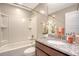 Bright bathroom with shower-tub, white sink, and granite countertops at 3941 Four Poles Park Dr, North Charleston, SC 29405