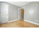 Bedroom with a door opening to another room and a light-toned floor at 3941 Four Poles Park Dr, North Charleston, SC 29405