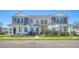 Well-maintained two-story townhomes with inviting front lawns and colorful landscaping at 3941 Four Poles Park Dr, North Charleston, SC 29405