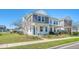 Charming two-story home with landscaped front yard and inviting covered porch at 3941 Four Poles Park Dr, North Charleston, SC 29405