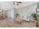 Bright and airy living room with hardwood floors, contemporary furniture, and stylish ceiling fan at 3941 Four Poles Park Dr, North Charleston, SC 29405