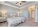 Bright and airy main bedroom with a decorative ceiling, ceiling fan, and neutral decor at 3941 Four Poles Park Dr, North Charleston, SC 29405