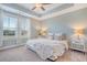 Relaxing bedroom featuring natural light, a tray ceiling, ceiling fan and light blue walls at 3941 Four Poles Park Dr, North Charleston, SC 29405