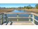 Elevated boardwalk view of tranquil water, offering a serene natural landscape perfect for relaxation at 3941 Four Poles Park Dr, North Charleston, SC 29405