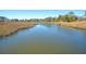 Picturesque water view from a boardwalk, showcasing marshland landscape and the peaceful flow of the river at 3941 Four Poles Park Dr, North Charleston, SC 29405