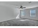Spacious bedroom features neutral carpet, ceiling fan and large windows that offer ample natural light at 429 Cherrybark Oak St, Summerville, SC 29486