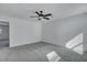 Bright bedroom boasts neutral carpet, a ceiling fan, and fresh paint at 429 Cherrybark Oak St, Summerville, SC 29486