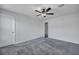 Spacious bedroom featuring neutral walls, gray carpet, and ceiling fan at 429 Cherrybark Oak St, Summerville, SC 29486