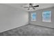 Neutral bedroom with a ceiling fan and two windows providing natural light at 429 Cherrybark Oak St, Summerville, SC 29486