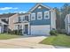Charming two-story home featuring a spacious two-car garage and a beautifully maintained front yard at 429 Cherrybark Oak St, Summerville, SC 29486