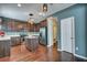 Modern kitchen with stainless steel appliances, wooden cabinets, hardwood floors and an island at 429 Cherrybark Oak St, Summerville, SC 29486