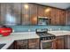Well-equipped kitchen with stainless steel microwave and gas range for cooking enthusiasts at 429 Cherrybark Oak St, Summerville, SC 29486
