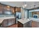 Open kitchen with a large island and stainless steel refrigerator, enhancing the social feel at 429 Cherrybark Oak St, Summerville, SC 29486