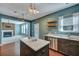 Open kitchen with a large island and adjacent living area, enhancing the social feel at 429 Cherrybark Oak St, Summerville, SC 29486