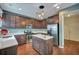 Updated kitchen featuring stainless steel appliances, wood cabinets, a kitchen island, and hardwood floors at 429 Cherrybark Oak St, Summerville, SC 29486