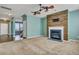 Open floorplan with living room and kitchen area featuring fireplace and hardwood floors at 429 Cherrybark Oak St, Summerville, SC 29486