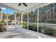 Inviting screened porch with a ceiling fan and view of the landscaped backyard at 429 Cherrybark Oak St, Summerville, SC 29486