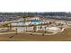An aerial view of a community recreational area showcasing pools, playgrounds, and seating areas at 433 Cedarview Rd, Summerville, SC 29486