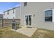 Backyard with a grill and sliding glass door, featuring a small patio area at 433 Cedarview Rd, Summerville, SC 29486