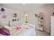 Light and airy Bedroom with floral-themed bedding, dresser, and shelves for a charming space at 433 Cedarview Rd, Summerville, SC 29486