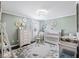 Charming Bedroom features a crib, dresser, rocking chair, and soft, inviting decor for a baby's comfort at 433 Cedarview Rd, Summerville, SC 29486