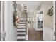 Inviting foyer with wood-look floors, staircase, and decorative accents that welcomes you into a beautiful home at 433 Cedarview Rd, Summerville, SC 29486
